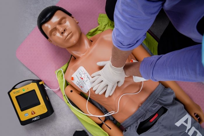 ViVest X3 defibrillator in use on a CPR manikin during training session